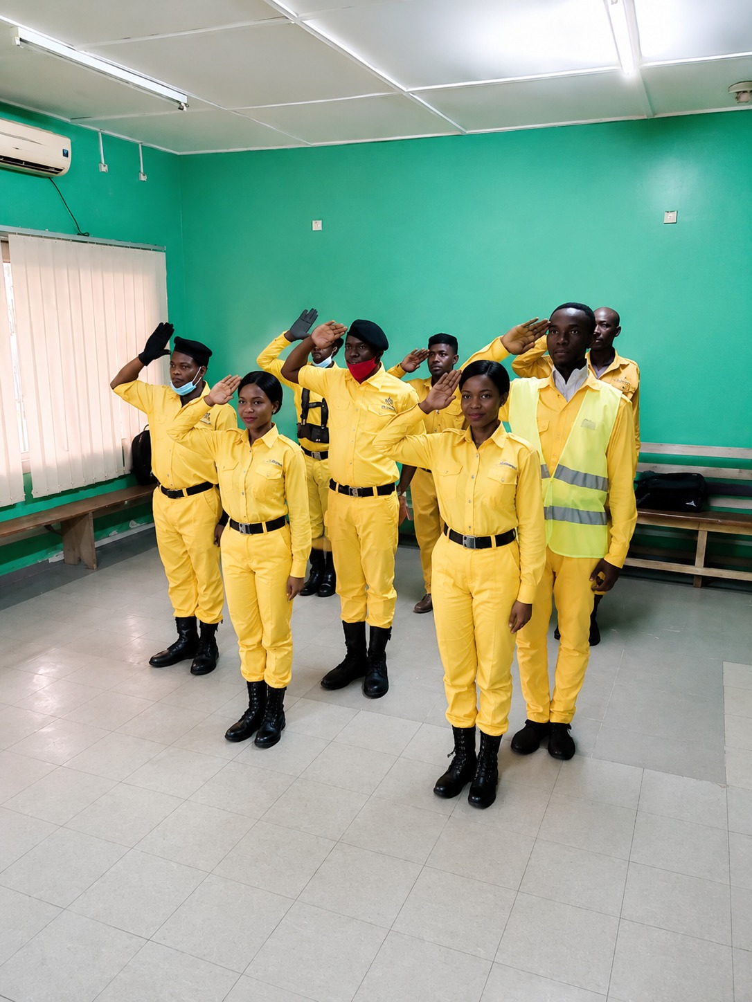 Spider Security Services officers standing in salute formation